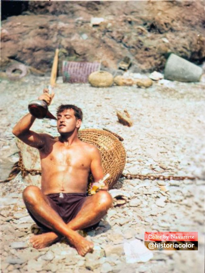 Summer of 1929 at Cap de Creus, Cadaqués. Luis Buñuel drinks wine from a porrón on the beach.