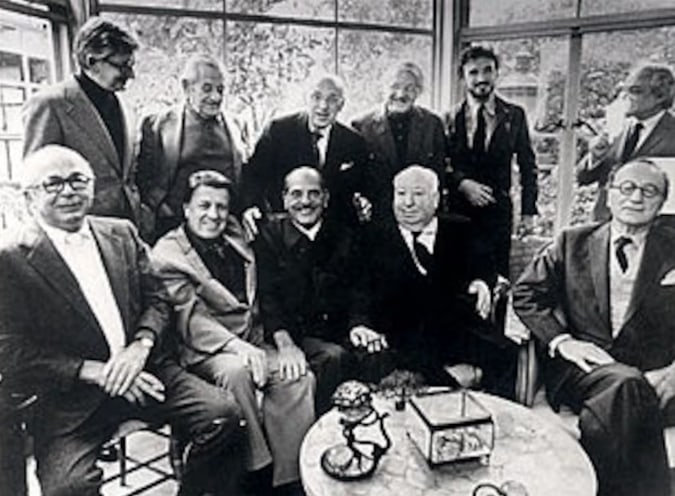 Standing, left to right: Robert Mulligan, William Wyler, George Cukor, Robert Wise, Jean-Claude Carrière, and Serge Silberman. Seated, left to right: Billy Wilder, George Stevens, Luis Buñuel, Alfred Hitchcock, and Rouben Mamoulian.